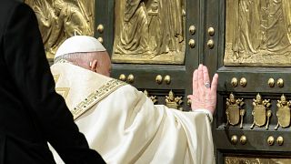 Pope Francis opens the Holy Door to mark the opening of the 2025 Catholic Holy Year, or Jubilee, in St. Peter's Basilica, at the Vatican, Dec. 24, 2024. 