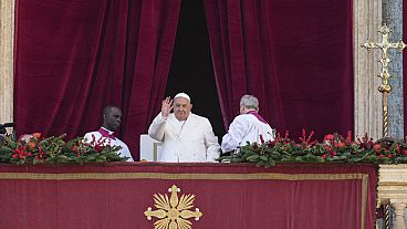 Pope Francis waves before delivering the Urbi et Orbi Christmas' day blessing from the main balcony of St. Peter's Basilica at the Vatican, Wednesday, Dec. 25, 2024.